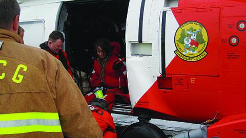 A U.S. Coast Guard helicopter delivers passengers from the sailing ship Bounty after the ship foundered during superstorm Sandy last October. 
