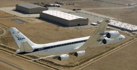 NASA's DC-8 airborne science laboratory flies over the Dryden Aircraft Operations Facility, Palmdale, California. The  DC-8 is participating in ACCESS flights measuring the emissions and performance of biofuels in jet engines.  (NASA Photo)
