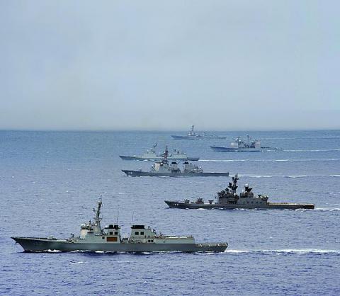 Ships from the Japan Maritime Self-Defense Force, the Republic of Korea Navy, and the U.S. Navy maneuver through the Pacific Ocean during a trilateral exercise. PACOM’s J-6 directorate is working to enhance coalition communications in its area of responsibility.