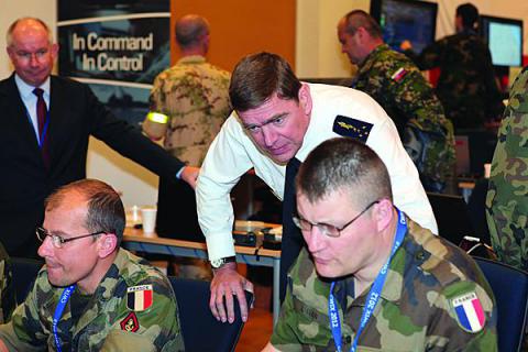  Gen. Stephane Abrial, FRA, Supreme Allied Commander Transformation (ACT), observes part of the Coalition Warrior Interoperability Exercise (CWIX) 12 held in June. The exercise helped validate the effectiveness of the new Tactical Edge Data Solutions (TEDS) joint capability technology demonstration (JCTD).