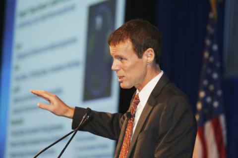 John Smart, president of the Acceleration Studies Foundation, tells the keynote luncheon audience that dramatic change is evolutionary and inevitable.