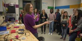Caroline Scheck, a mechanical engineer with the Additive Manufacturing Project Office, tells middle- and high-school students with the Washington, D.C., Girls in Technology program about the Manufacturing, Knowledge and Education Lab, Naval Surface Warfare Center in March. (U.S. Navy photo by Dustin Q. Diaz/Released)