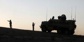 U.S. Marines conduct operations in Afghanistan as part of the International Security Assistance Force. The NATO Secret-level network in Afghanistan, outsourced to private industry, serves as an example of how future NATO information technology might be acquired through outsourcing.