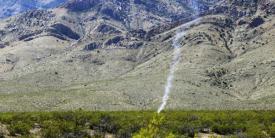 Smoke rises from an unmanned aerial vehicle after it was engaged by a counter system in March during the Hard Kill Challenge in New Mexico. Sponsored by the Defense Threat Reduction Agency (DTRA) and the Joint Improvised-Threat Defeat Organization (JIDO), the challenge focused on stopping the growing threat posed by unmanned aerial systems. Photo by 1st Lt. Chelsi Spence, USAF, DTRA