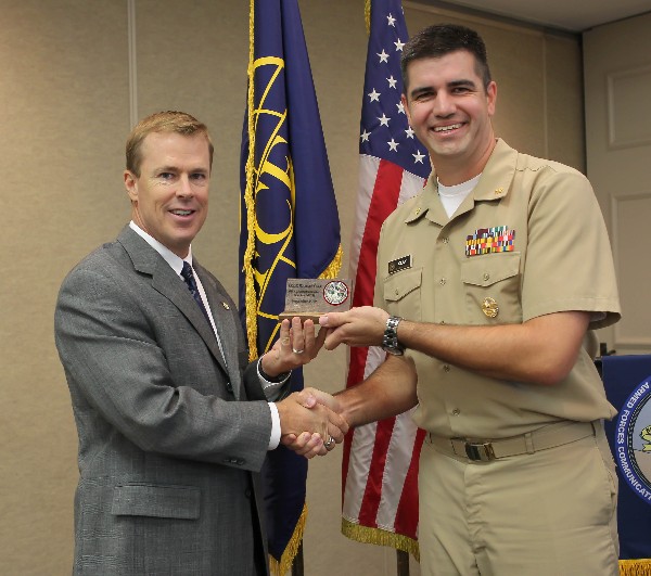 Lt. Cmdr. Michael Clay, USCG (r), director of Military Health System Cyberinfrastructure Services, receives a special thank you from Bill Morrow, chapter president, during the chapter's September luncheon.