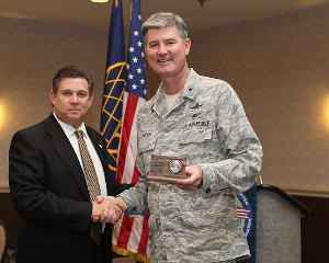 Gen. Uhrich receives thanks from Bill Robinson, chapter vice president for corporate affairs, following the general's speech at the January luncheon.
