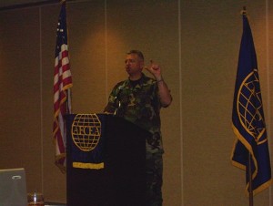 Col. Mark S. Kross, USAF, 26th Network Operations Group, briefs the chapter in March.