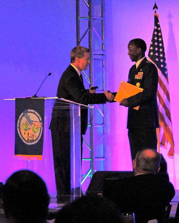 In December, Bill Morrow, chapter president, presents a chapter coin to Gen. Edward A. Rice, USAF, commander, Air Education and Training Command, following his keynote address at the third annual ACE. Rice said the Air Force is meeting recruiting goals for cyber, but better skills and aptitudes testing measures are in development. Just because you can operate your iPhone, doesn’t mean that you can operate in an increasingly complex and sophisticated cyberdomain role, he said.