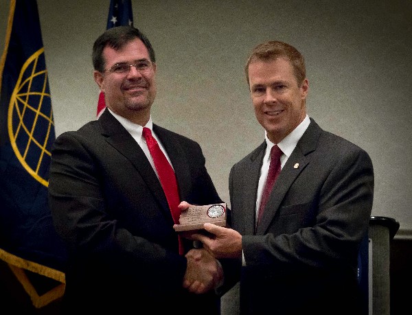 Brig. Gen. Scott A. Bethel, USAF (Ret.) (l), former vice commander of the Air Force Intelligence, Surveillance and Reconnaissance Agency, receives a special thank you from Bill Morrow, chapter president, for serving as guest speaker during the August luncheon event.