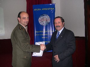 Maj. Gen. Norberto R. Dimeglio, FAA (Ret.) (r), chapter second vice president, presents a certificate to Lt. Col. Adrian Buscaglia, EA, program manager for army research and development, for speaking at the September event.