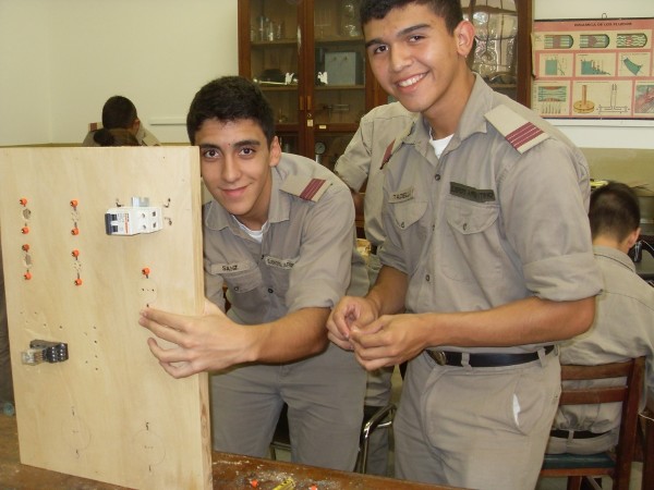 Cadets work on an electrical panel in June as part of a project funded by a chapter grant.