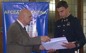 Maj. Gen. Francisco E. Machinandiarena, EA (Ret.) (l), chapter president, presents a check and certificate to Cadet Matías Rodriguez Aro, a student at Liceo Militar General Paz, in October for his winning science fair project.