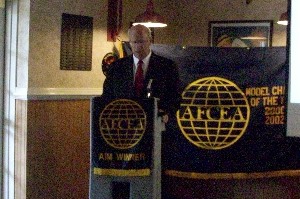 Kent R. Schneider, president and chief executive officer of AFCEA International, discusses defense budget concerns during the chapter's September meeting.