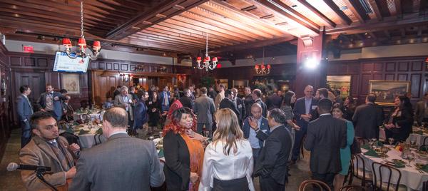 Winter IT Luncheon attendees network at a reception before the seventh annual event in March.