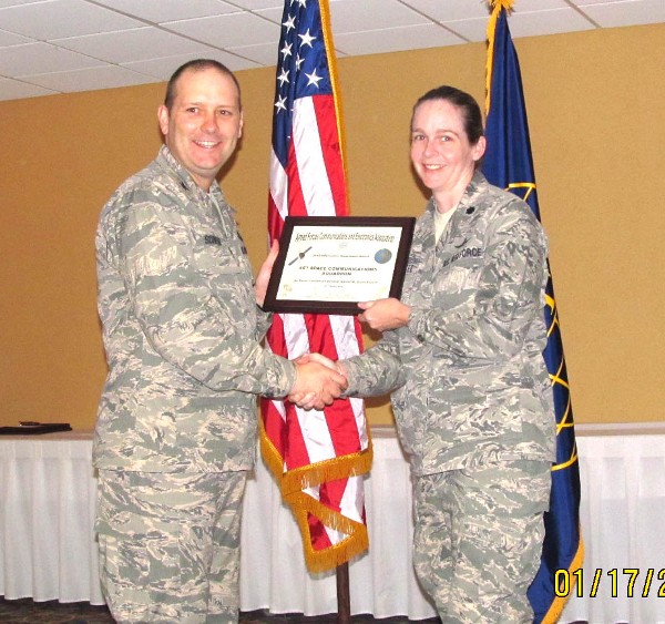 Col. Schiess (l) presents the Lt. Gen. Harold W. Grant Award in January to Col. Cantwell on behalf of the 45th Space Communications Squadron.