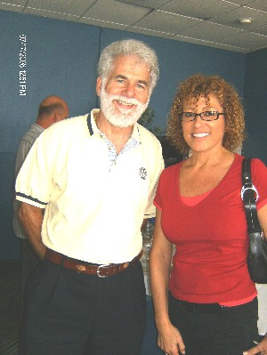 Terry Casto, outgoing regional vice president, and Maria Febles network after the July meeting.