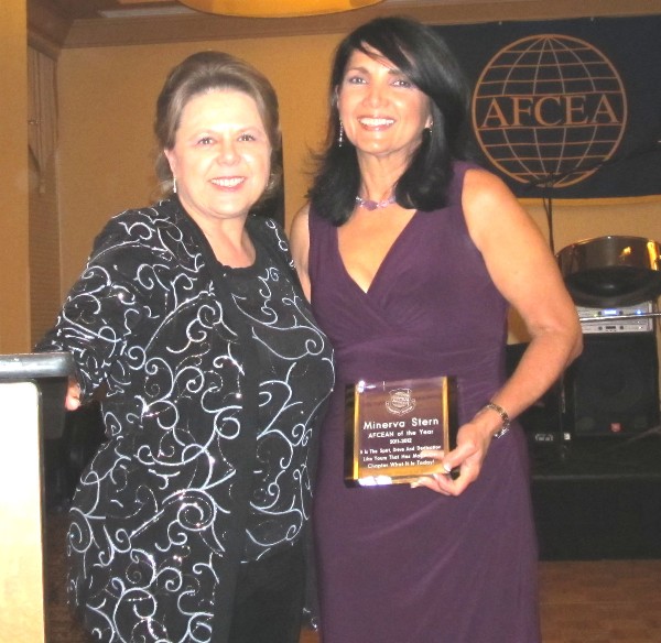 Glore (l), mistress of ceremonies for the October banquet, presents Stern with a plaque recognizing her as the chapter’s AFCEAN of the Year for her exceptional performance.