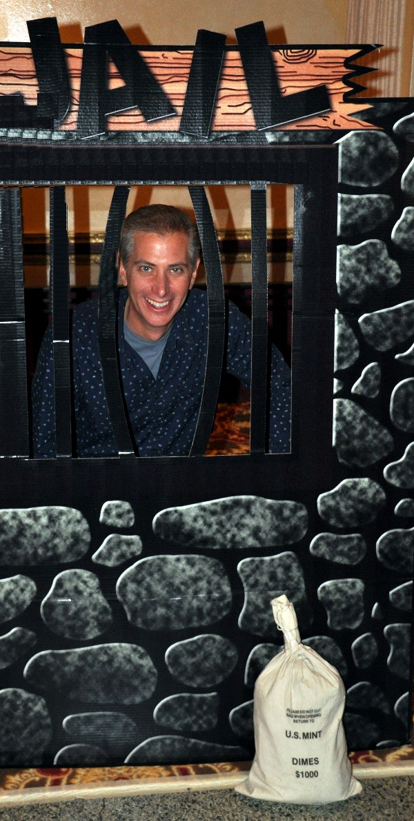 Quentin Smith, Praxis Engineering and chapter vice president for programs, stops for a photo opportunity in “jail” at the chapter's November fundraiser, which brought in roughly $40,000 for scholarships.