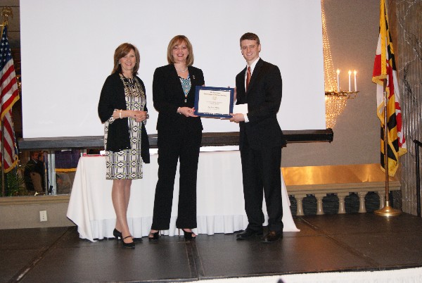 Chapter representatives present Zac Miller with the AFCEA International Cyber Scholarship in February. 