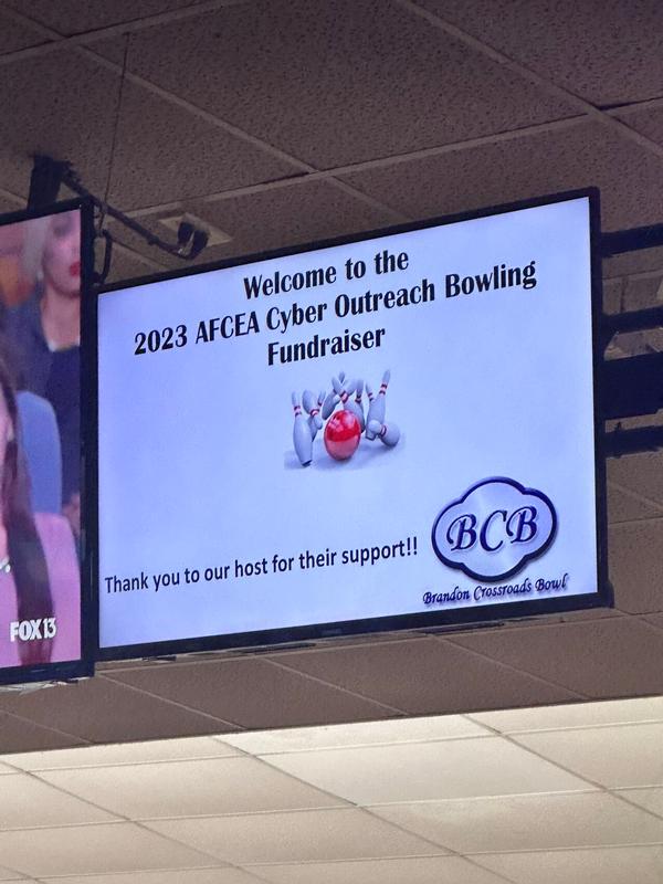 A banner welcomes participants to the 6th Annual Bowling Tournament in August.