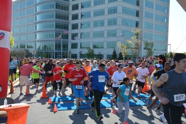 Runners take off at the starting line of the 7th Annual Race for Excellence 5K & Fun Run in May.