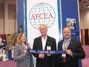 Jackie Whittaker (l), chapter president; Rick Wegmann (c), chapter board president; and Dave Hart, immediate past chapter president, showcase the chapter's Model Chapter of the Year Award in May.