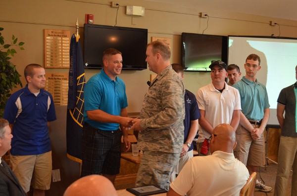 Master Sgt. Matthew Collingridge, USAF (r), TechNet Golf Tournament coordinator for the chapter, shakes hands with Col. Eric Bjurstrom, chapter president and commander, Defense Information Systems Agency Field Office at U.S. Strategic Command, Offutt Air Force Base. Master Sgt. Collingridge was instrumental in putting together the AFCEA Heartland TechNet Golf Tournament, held in June at the Tregaron Golf Course, Bellevue, Nebraska. Several vendors exhibited in conjunction with the golf tournament, including: Clearfield, Minneapolis; Hewlett-Packard, Palo Alto, California; Iron Bow Technologies, Chantilly, Virginia; Pivot3; Austin, Texas; STERLING Computers Corporation, Norfolk, Nebraska; and Wesco Communications Supply Corporation, Carol Stream, Illinois. In addition, the tournament was co-hosted by the following sponsors: Commscope Incorporated, Hickory, North Carolina; CSC, Falls Church, Virginia; GEIST Global, Lincoln, Nebraska; Harris, Melbourne, Florida; Hewlett-Packard; Iron Bow Technologies; ITT Exelis Mission Systems, Colorado Springs, Colorado; Symantec, Mountain View, California; SES, Bellevue, Nebraska; STERLING Computers Corporation; and TEK Systems, Hanover, Maryland.