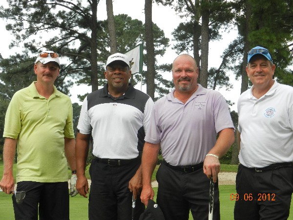 Afternoon golfers at the chapter's charity tournament in September are Steve, J.R., Mel and Palmer.