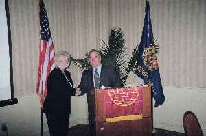 Glenda Bluhm, chapter president, thanks Greg Knapp, executive director of the Joint Warfighting Center, following his presentation at the April meeting. 