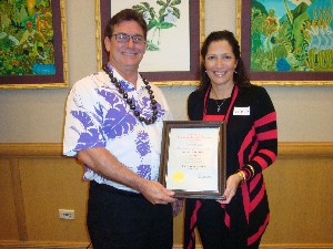 Shaefer (l) receives the AFCEAN of the Month Award from Pacheco at the January meeting.