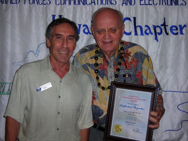 Bloom (l) honors Martin, 30-Year Member and AFCEAN of the Month at the chapter's May meeting.
