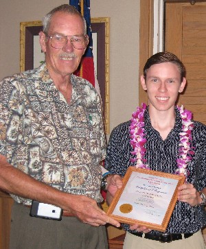 Adm. Macke (l) presents the chapter's Student of the Month award to Jeffrey Spraker of Radford High School, Hawaii.