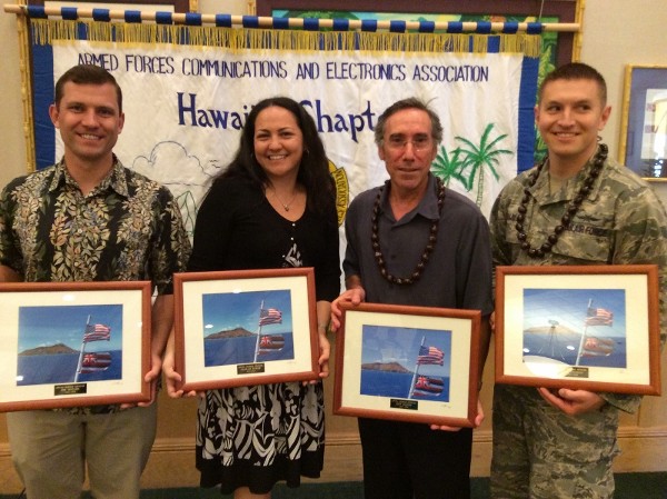 Outgoing chapter officers together at the April luncheon are (l-r) Jim Muller, vice president for membership; Farrah Burke, secretary; Jeff Bloom, executive vice president; and 1st Lt. Dan Trujillo, USAF, vice president for awards.