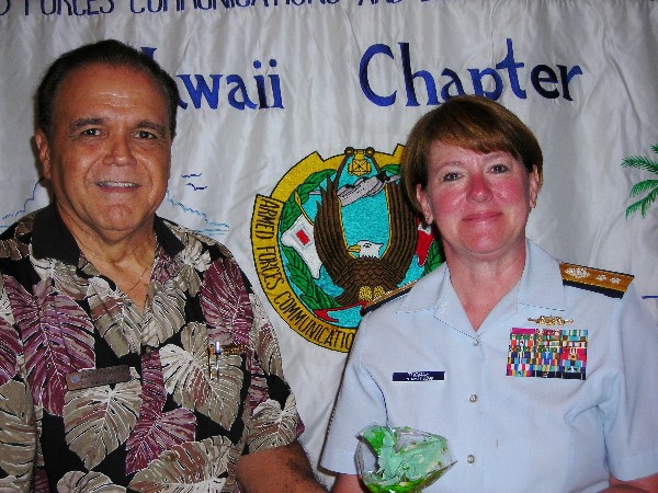 Cory Lindo, chapter president, thanks speaker Rear Adm. Cari B. Thomas, USCG, commander, Fourteenth Coast Guard District, following her presentation at the August meeting.
