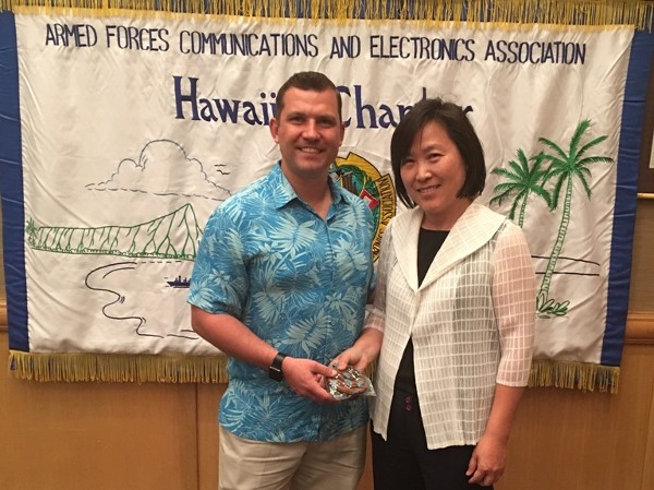 Chapter President Jim Muller thanks Miyi J. Chung of the Defense Information Systems Agency Pacific Field Command (DISA-PAC), the chapter's February luncheon speaker.