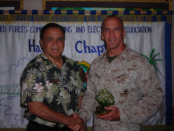 HAWAII—Cory Lindo, chapter president, greets July luncheon speaker Brig. Gen. Richard Simcock II, USMC, deputy commander, U.S. Marine Corps Forces Pacific.