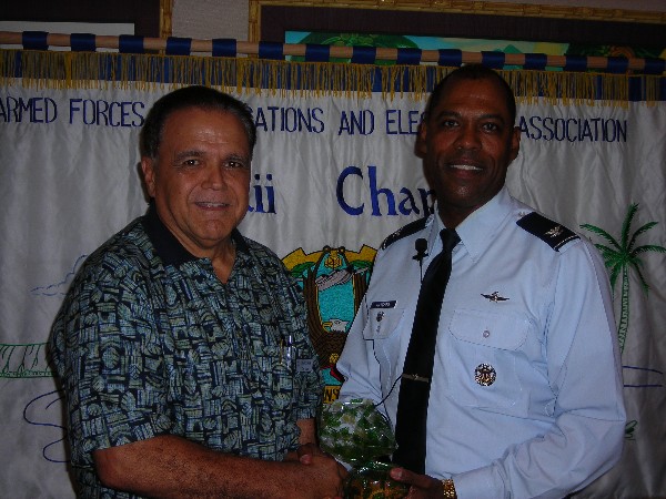 In April, Cory Lindo, newly appointed chapter president, presents a token of appreciation to guest speaker Col. A.G. Hatcher, USAF, Pacific Air Force A-6.