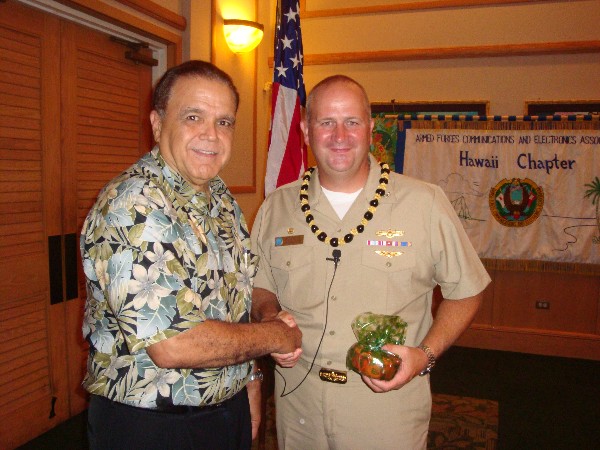 Cory Lindo (l), chapter vice president, thanks the guest speaker Capt. John MacMichael, USN, commanding officer of Naval Computer and Telecommunications Area Master Station Pacific, following his speech at the September luncheon.