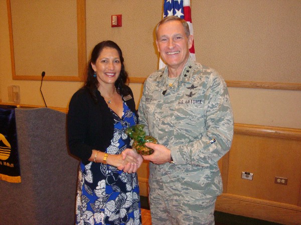 Cynthia Pacheco, chapter president, recognizes the January guest speaker Lt. Gen. Michael Basla, USAF, chief, information dominance, and chief information officer, Office of the Secretary of the Air Force.