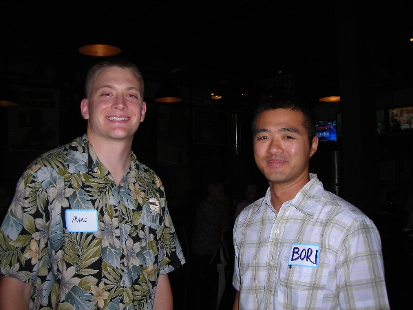 Capt. Marc Aurilio, USAF (l), Young AFCEAN Council vice president for government, and Capt. Bori Um, USAF, 747 Communications Squadron, networking during the November Young AFCEAN event.