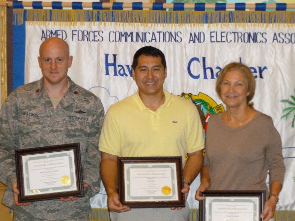 Award winners at the November luncheon are (l-r) Maj. Joseph Watson, USAF, commander, Air Force Detachment 3, 690th Network Support Squadron, Young AFCEAN of the Month; Jake Ross, U.S. Pacific Command Computer Network Defense section chief, AFCEAN of the Month; and Joy Hess representing Executive of the Month Craig Horiuchi of Wakelight.