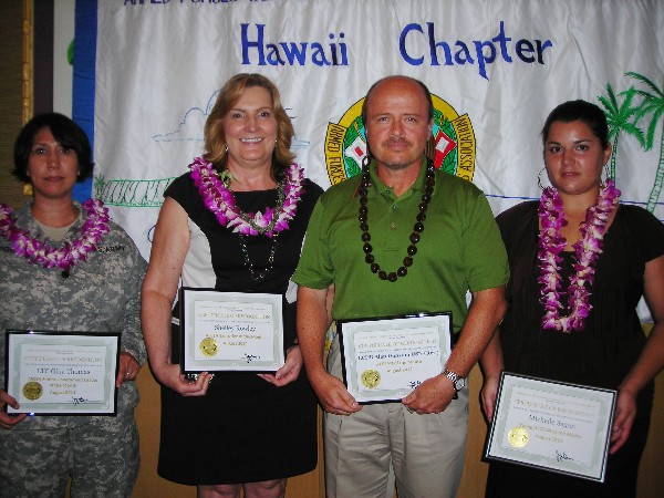 August award winners are (l-r) Lt. Col. Gina Thomas, USA, deputy G-6, 94th Army Air Missile Defense Command, Senior Government Leader of the Month; Shelley Rowley, program manager, Hawaii Medical Services Association, Executive of the Month; Lt. Cmdr. Alan Dunston, USN (Ret.), AFCEAN of the Month; and Michelle Sagan, senior consultant, Booz Allen Hamilton, Young AFCEAN of the Month.