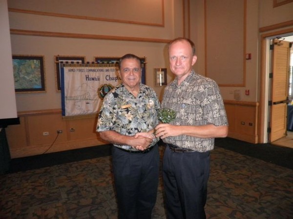 HAWAII—Cory Lindo, chapter president (l), greets June luncheon speaker Steven Gallagher, executive director, National Oceanic and Atmospheric Administration’s Daniel K. Inouye Regional Center.