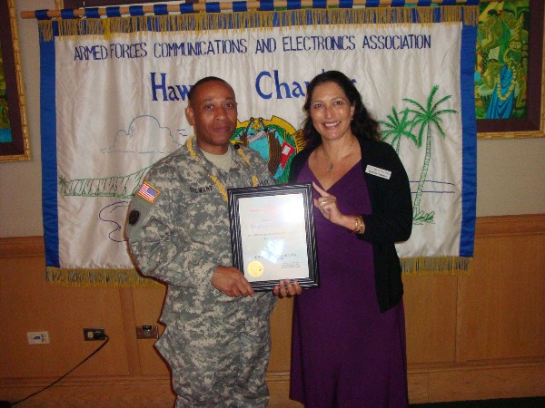 In February, Col. Stewart receives the Senior Government Leader of the Month Award from Pacheco.