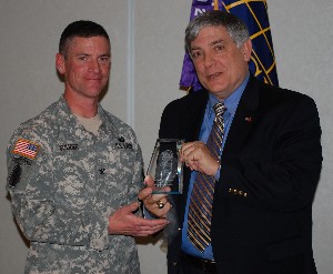 March guest speaker Col. Jeffrey K. Souder, USA (l), project manager, European Component Initiative, Missile Defense Agency, accepts a token of appreciation from Vic Budura, chapter president.