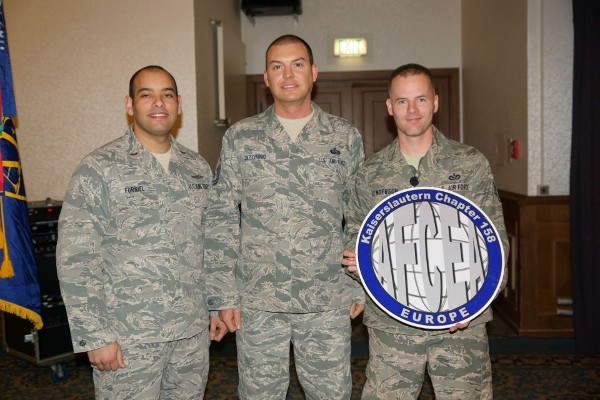Accepting $300 continuing education scholarships in December are (l-r) 2nd Lt. Ronald Furniel, USAF; Master Sgt. John Dizonno, USAF; and Staff Sgt. Freddie Henderson, USAF.