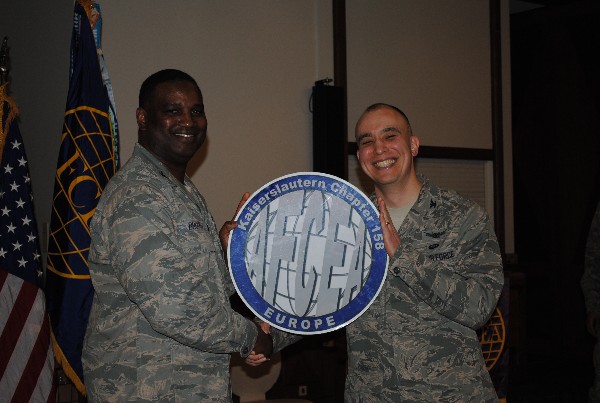 In February, Col. Kurt Gaudette, USAF (r), commander, 693 Intelligence, Surveillance, and Reconnaissance Group, receives a chapter coin from Lt. Col. Christopher D. Brooks, USAF, chapter first vice president.