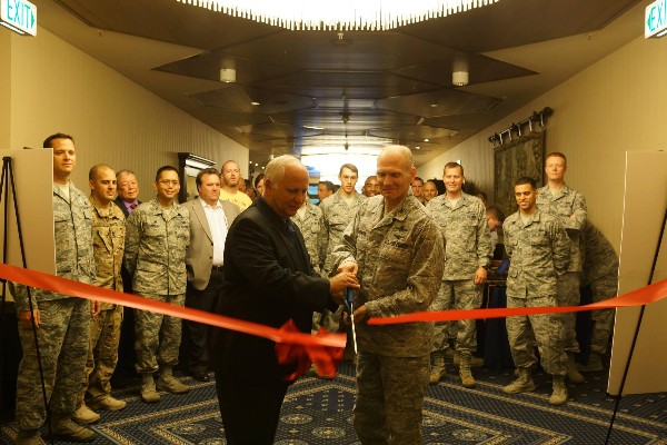 Maj. Gen. John Maluda, USAF (r), and Col. Douglas Barron, USAF (l), cut the ribbon officially opening the 2014 Ramstein Summer Technology Expo.