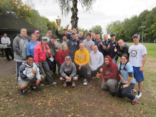 Team members from the 86th Communications Squadron, U.S. Air Force, proudly raise their first place trophy from the Kaiserslautern Military Community Sports Day held in October.