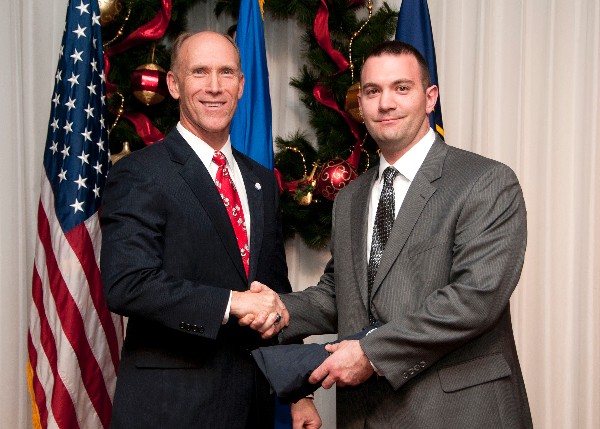 In December, Bud Vasquez (l), chapter first vice president, congratulates the chapter's 2012 Unsung Hero: Stephan Nadeau, Wyle.